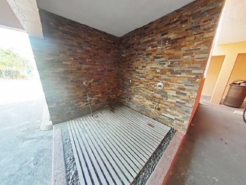 Outdoor Beach Shower located near the carport parking. Shared with others.