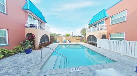 Relax on the lounge chairs near the pool.Depth:3ft-4ft. Shared with other guests
