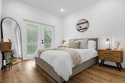 Queen-sized bedroom with french doors that lead right off to a balcony.