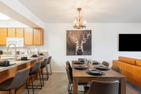 Bar top seating and dining table offer plenty of gathering spaces