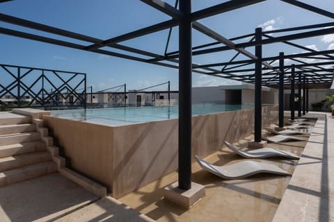 Sundecks by the Olympic pool—perfect for sunbathing & relaxation
