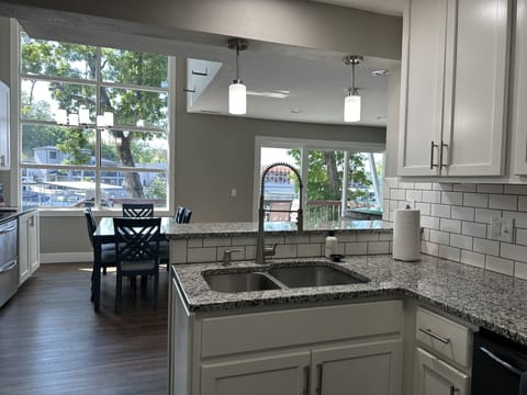 Kitchen and dining overlooks to the beauty of outdoors.