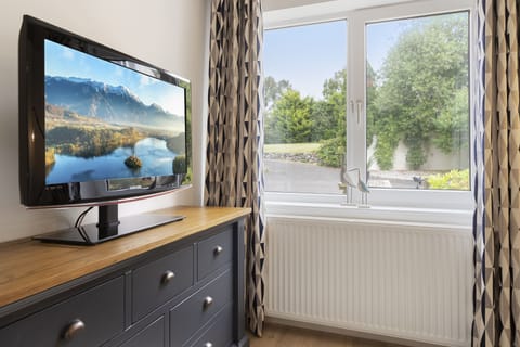 Ground floor bedroom with king size bed and en suite shower room