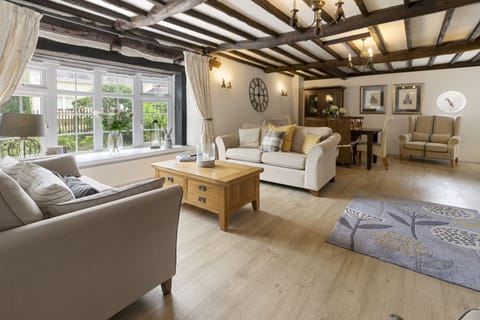 Open plan lounge and dining room with wood burning stove