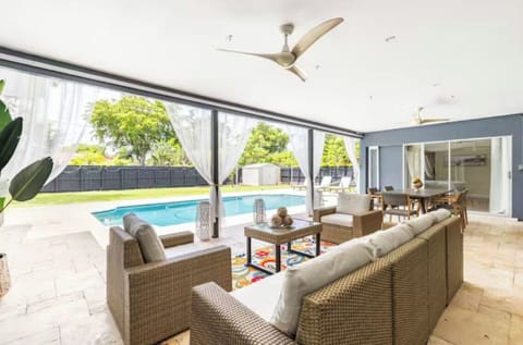 Outdoor dining room with view to the pool.