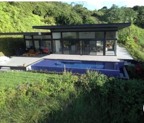 Main house with infinity edge ocean view pool