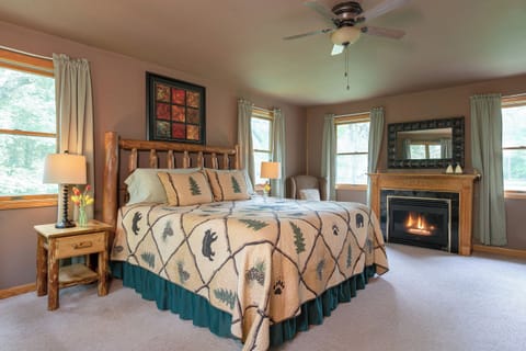 King sized log bed in bedrdoom with gas fireplace (winter use only)