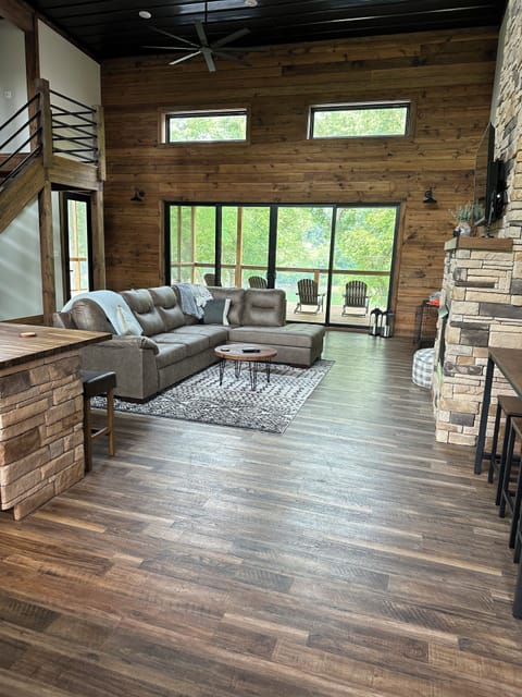 Living room and view to the river as soon as you walk in the front door 