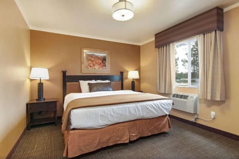 Recharge in comfort with workspace, TV, and easy vanity access.