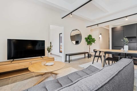 Lounge back in our sleek living area, your perfect spot to relax after a day's adventures.