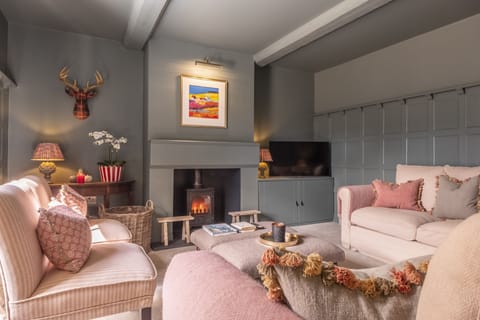 Old Mill House, Brancaster: Sitting room with wood burning stove and Smart television