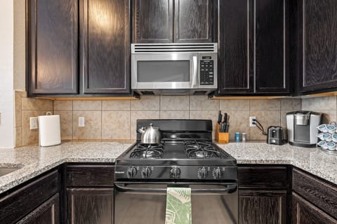 Let our built-in microwave and gas range aid in preparing your meals.