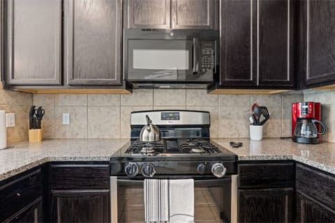 Let our built-in microwave and gas range aid in preparing your meals.