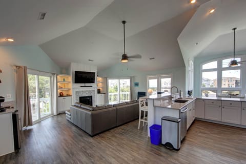 Living Area - Large windows, high ceilings with natural light make this open concept living space an entertainer's dream.