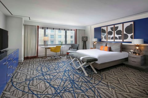 Unwind in a spacious king room with calming city views.