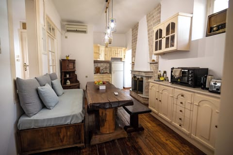 Kitchen with a fireplace and a monastery type dinning table