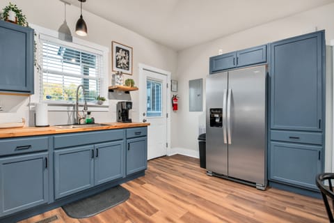 Large refrigerator. Toast and ninja blender in pantry