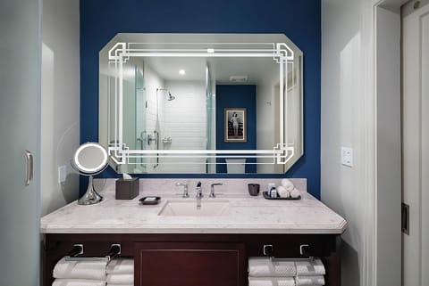 Refresh easily at a sleek vanity with spa-bright lighting.