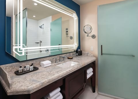Start your day smoothly with a spacious counter and glass shower.