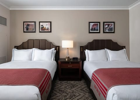 Recharge together in a cozy double room with warm lighting.