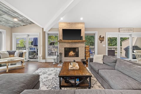 Living room with fireplace, tv, board games