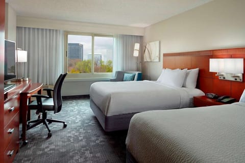 Settle into comfortable double beds with a calming city view.