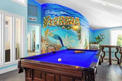 Game room with pool table and arcade and game boards