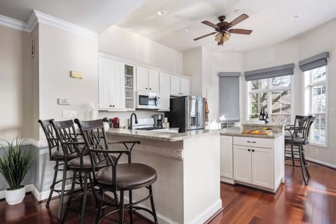The breakfast bar and island are perfect for having some predinner drinks.