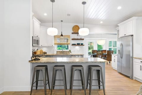 Bar stools between the living room and kitchen.