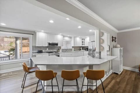 Beautiful, spacious kitchen with double ovens and a Keurig. 