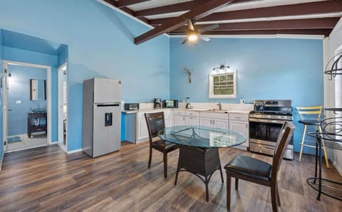 The kitchen has newer appliances and is equipped for basic cooking. The