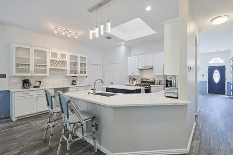 Whip up your go-to favorite meals in this fully equipped kitchen! Not only does it have a functional kitchen island, it also has a breakfast bar, and upgraded features!