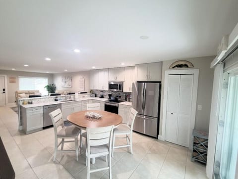 Open Kitchen with Stainless Steel Appliances and Granite Counters