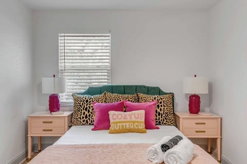 "Cozy up buttercup" in bedroom 2's queen bedroom full of sass and color. 