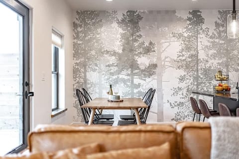 Welcome to Evergreen!  A unique forest-themed wallpaper backdrops the downstairs space.