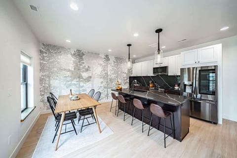 Open dining and kitchen space with seating for 8.