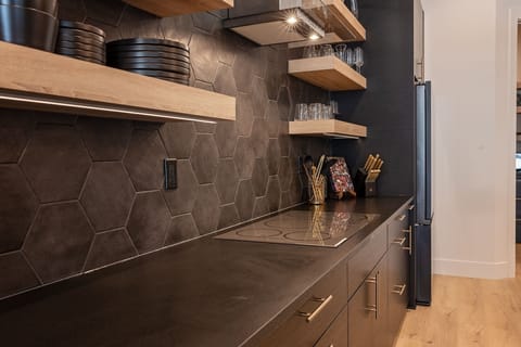 Kitchen- Counter top range in addition to the double ovens.