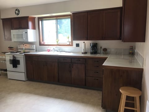 Gallery-type kitchen. Upper cabinets are new; lower cabinets are original. 