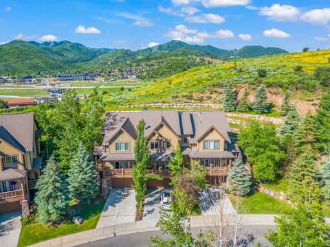 - Inviting front view of home with landscaped greenery around  
- Spacious driveway and cozy porch for relaxing outdoors  
- Nestled among mountains with easy town and trail access
