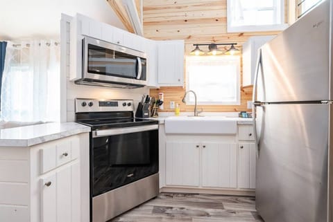 For a tiny kitchen, this one features full size appliances and is well appointed.
