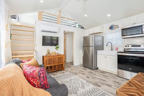 Open concept living area with well appointed kitchen