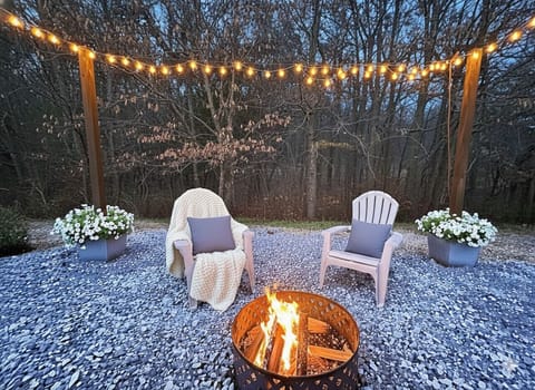 Outdoor Retreat: Gather around the firepit under string lights for unforgettable evenings!