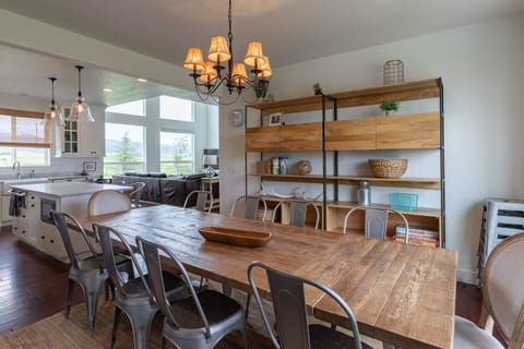 Dining table seats 10 comfortably, with extra stools nearby for added space