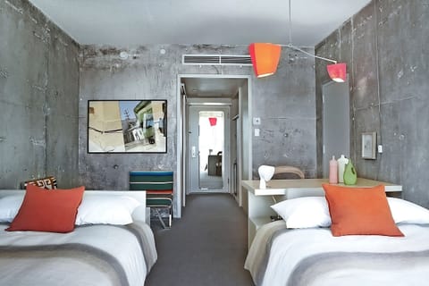 Settle in comfortably with two airy beds and bold design