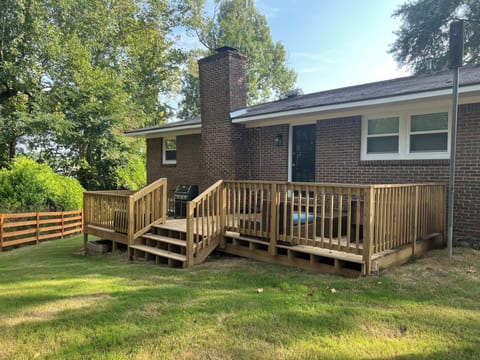New back deck with propane grill and outdoor seating. 