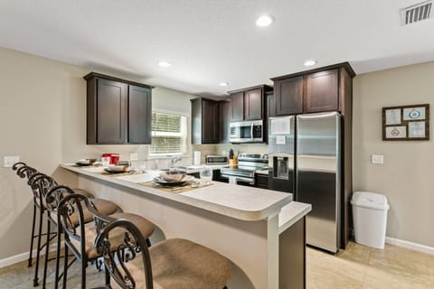 Open living area with eat-in Kitchen counter