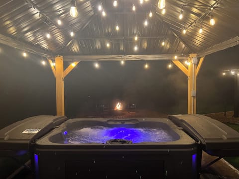 Hot tub under the pergola — perfect for winter evenings