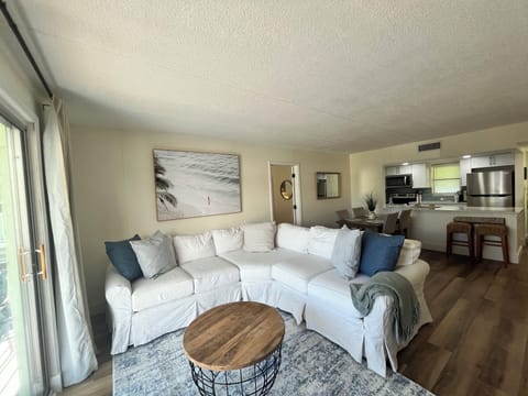 Open plan living room area with split plan bedrooms and bathrooms