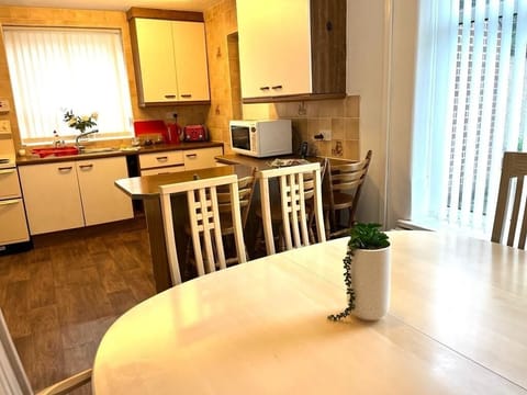 Open plan kitchen diner with breakfast bar