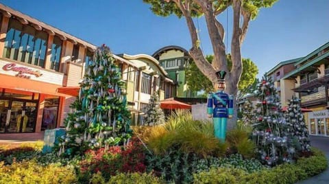 Arrive to a festive courtyard setting steps from shops.